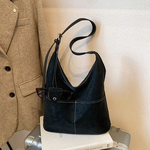 Minimalist black faux leather hobo bag with contrast white stitching and large capacity