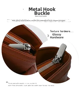 Polished silver metal hardware details and smooth zipper of the brown bowling bag