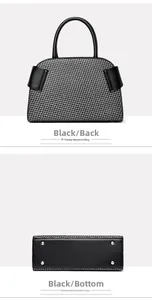 Detail of woven handbag showing the black matte leather bottom with silver metal feet