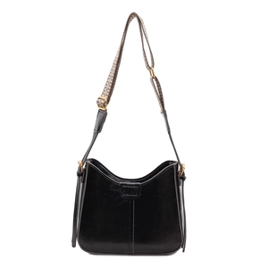Vintage black faux leather crossbody saddle bag with geometric woven shoulder strap