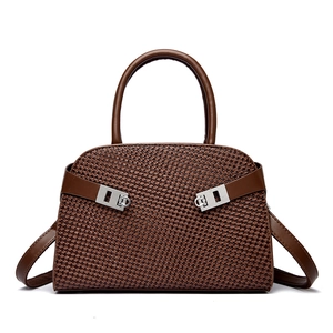 Brown woven handbag with silver metal buckles and leather handles for women commuting