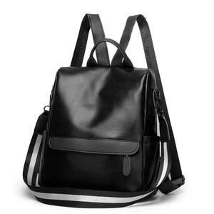 Classic black leather travel backpack with detachable striped woven shoulder strap for women