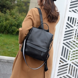 Chic black soft leather backpack for women featuring a stylish striped decorative strap