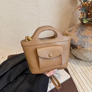 Caramel brown PU leather basket bag with integrated handle and small front flap pocket