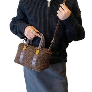 Brown faux shearling handbag with leather trim and gold hardware for autumn and winter