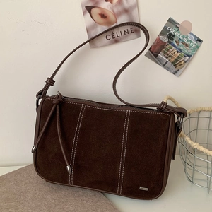 Brown suede shoulder bag with contrast stitching and tassels in retro square shape