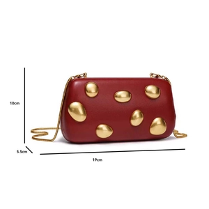 Detail view of red evening bag with gold pebble studs and chain, size 19x10x5.5cm