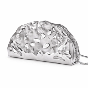 Close-up of silver taco-shaped evening bag featuring unique hammered metal liquid texture