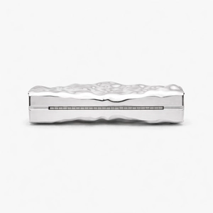 Detailed view of silver acrylic evening clutch bag with unique liquid ripple texture