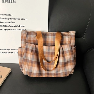 Retro plaid canvas tote bag with multi-pocket design and wide brown nylon handles