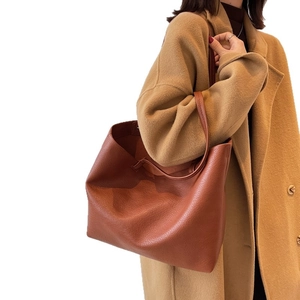Brown large capacity leather tote bag with pebble texture and shoulder straps for women