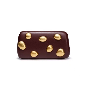 Artistic dark burgundy evening clutch bag with unique gold pebble metal studs on front