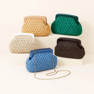 Detail of woven acrylic clutch bag collection with gold chain strap in multiple colors