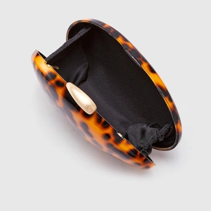 Elegant tortoiseshell acrylic clutch bag with gold clasp and black inner lining detail
