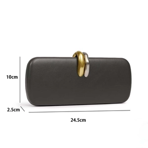 Detail of dark grey PU evening clutch with gold and silver rings, size 24.5x10x2.5cm
