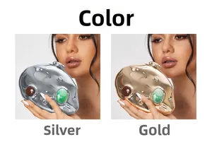 Irregular liquid metal clutch bag with large gemstone accents in silver and gold
