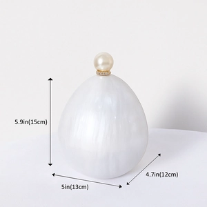 Elegant white acrylic marble evening bag with pearl top handle and gold ring closure