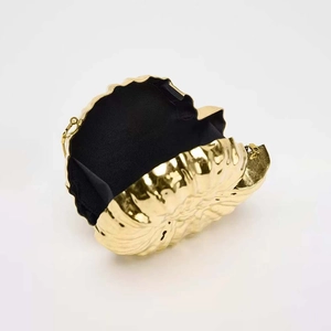 Elegant gold shell-shaped evening clutch bag with metal chain strap on white background