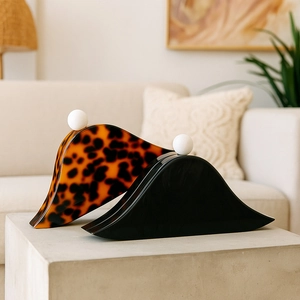 Elegant acrylic hair claws in tortoiseshell and black with white bead accents