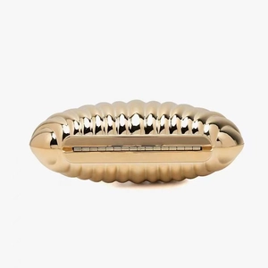 Elegant gold semi-circle evening clutch bag with textured corrugated pattern and metal hinge