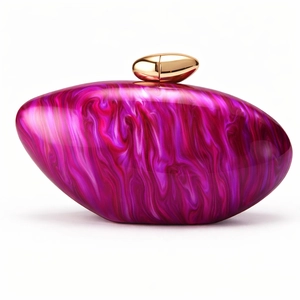 Detail of clear acrylic evening clutch with pink and purple marble texture and gold clasp