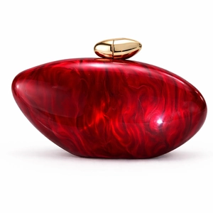 Detail of red marble acrylic evening clutch bag with elegant gold pebble clasp closure