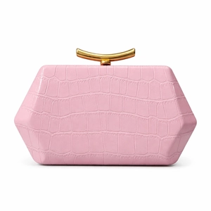 Detail of pink crocodile embossed hexagonal clutch with elegant gold metal handle