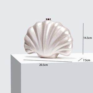 Detail view of shell evening bag showing dimensions 20.5cm width and 14.5cm height