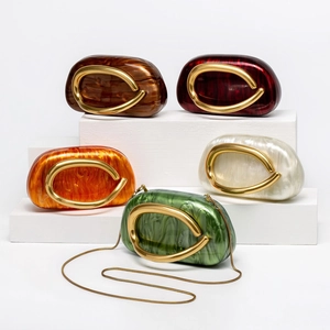 Chic shell-shaped acrylic marble clutch bags with gold metal accents and chain strap