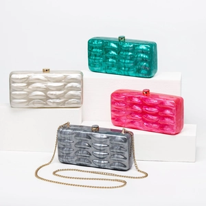 Detailed close-up showing acrylic shell bags with marble texture and ripple design