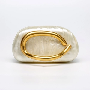 Elegant ivory acrylic shell clutch with marbled texture and gold U-shaped metal handle