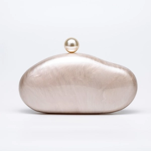 Elegant pebble-shaped acrylic clutch with mother of pearl texture and pearl clasp