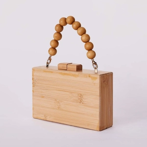 Handmade rectangular bamboo clutch bag with beaded handle and bohemian natural wood texture