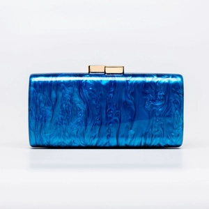 Women's acrylic shell evening clutch bag with blue marble texture and gold clasp