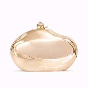Polished gold pebble-shaped evening clutch bag with creative snail clasp on white background