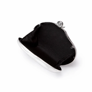 Internal view of silver metal box bag with black fabric lining and screw clasp detail