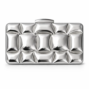 Detailed view of silver acrylic evening clutch with 3D quilted texture and metal clasp