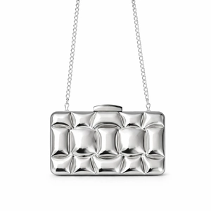 Detail of silver metallic evening clutch bag featuring a 3D geometric bubble texture