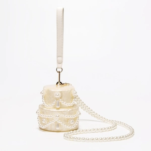 Elegant two-tier cake shaped acrylic clutch bag with faux pearls and crossbody strap