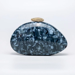 Pebble shaped marble acrylic clutch with diamond encrusted gold clasp for evening wedding