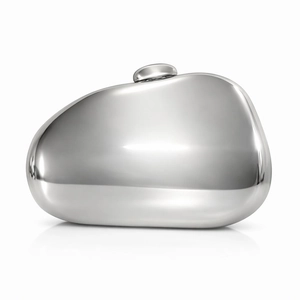 Silver pebble shaped evening clutch with mirror finish metal and snap closure on white