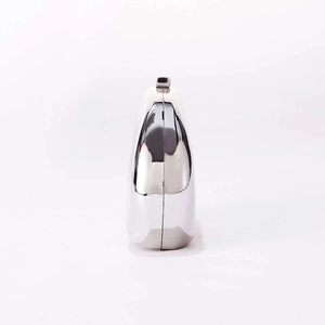 Side view of a sleek silver hard shell clutch bag with a high-shine mirror finish