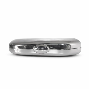 Close-up of a sleek polished silver oval metal clutch with mirror finish and curved clasp