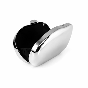 Detailed view of silver mirror evening clutch with black fabric lining and metal clasp