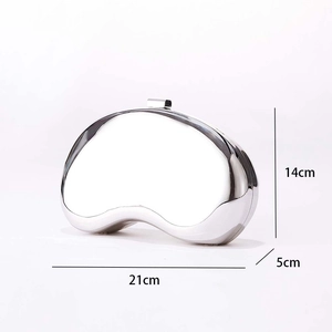 Detailed dimensions of a silver mirror-finish pod-shaped evening clutch bag