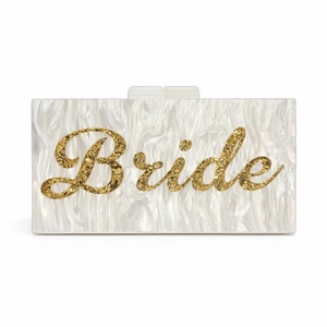 Detail view of pearl acrylic evening clutch featuring gold Bride lettering and clasp