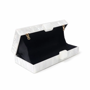 Elegant white pearlescent marble acrylic clutch bag with gold hinges for formal evening wear