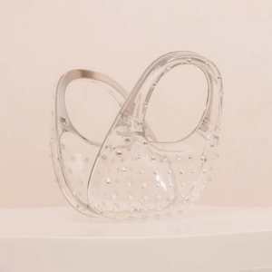 Minimalist transparent hollow hand-held acrylic bag with round cut-outs for beach or evening use