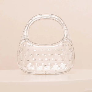 Modern transparent acrylic handbag with luxury crystal studs and unique oval ring handle