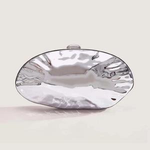 Chic silver metallic shell evening clutch bag with fluid wave texture and mirror finish